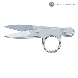 May include: Silver-toned fabric shears with a ring handle. The shears are labeled "gingher ITALY".
