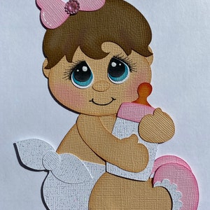 Sitting baby in pink paper piecing die cut scrapbook embellisment