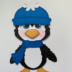 Penguin in blue hat paper piecing die cut scrapbook embellishment