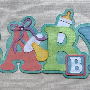 Baby paper piecing die cut scrapbook embellishment title