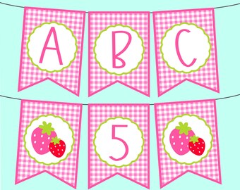 May include: Pink and green banner with the letters A, B, C, 5 and two strawberries on each of the strawberry flags.