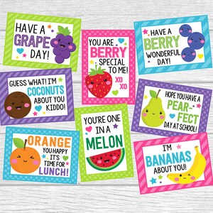 May include: Eight colorful cards with fruit illustrations and puns. The cards feature a grape, a berry, a coconut, a strawberry, a watermelon, a pear, an orange, and a banana. Each card has a different color background and a fun message.