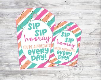 May include: Two pink and blue striped gift tags with gold glitter. The larger tag says "SIP SIP hooray YOU'RE APPRECIATED every DAY!" The smaller tag says "SIP SIP hooray YOU'RE APPRECIATED every DAY!"