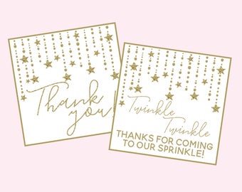 Può includere: Due biglietti di ringraziamento bianchi con stelle dorate scintillanti e il testo "Grazie" e "Twinkle Twinkle Grazie per essere venuto al nostro sprinkle!"
