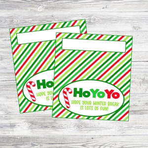 May include: Two red and green striped gift tags with a candy cane graphic and the text "Ho Ho Yo Yo Hope your winter break is lots of fun!"