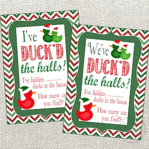 May include: Two Christmas cards with the text "I've DUCK'D the halls!" and "We've DUCK'D the halls!". The cards have green and red borders, duck illustrations in Santa hats, and prompts for a festive game, perfect for the holiday season.