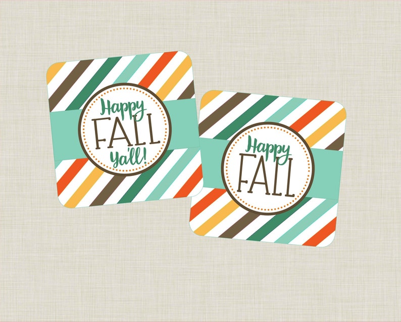 May include: Two square gift tags with a striped pattern in brown, orange, yellow, green, and blue. The tags have a circle with the text "Happy Fall Y'all!" in brown text.