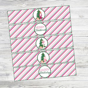 May include: Four pink and green striped printable labels with Christmas and birthday themes. The labels feature a nutcracker, a ballerina, a Christmas tree, and the text "Merry Christmas" and "Happy Birthday".