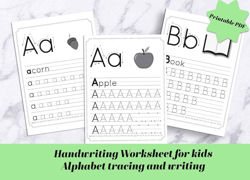 May include: Black and white printable handwriting worksheet for kids featuring the letters A and B. The worksheet includes tracing lines and space to practice writing the letters. The words "acorn" and "apple" are included for the letter A, and the word "book" is included for the letter B.