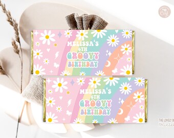 May include: Two candy bar wrappers with a pastel pink background, white daisies, and a rainbow. The text reads "Melissa's 6th Groovy Birthday". Other graphics include stars, lightning bolts, and moons.