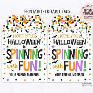 May include: Two Halloween-themed gift tags with a white background. The tags feature the text "Hope Your Halloween is Spinning with FUN!" in orange, green, and purple. The tags also include bats, spiders, and confetti.