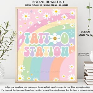 May include: A printable sign with a rainbow background and white daisies. The sign says "Tattoo Station" in a retro font with a smiley face.