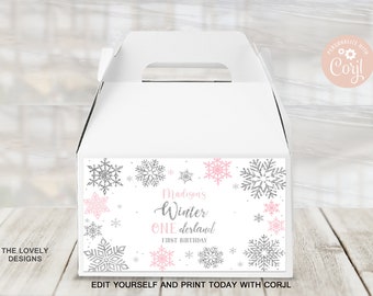 May include: White favor box with a snowflake design and the text "Madison's Winter Wonderland First Birthday".
