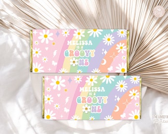 May include: Printable chocolate bar wrapper with a pink background, rainbow, and daisies. The text reads "Melissa is a groovy one".