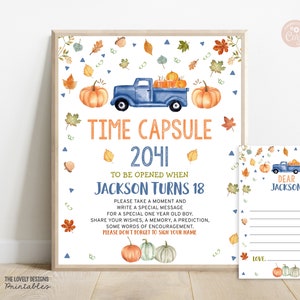 May include: A printable time capsule sign with a blue truck carrying pumpkins and fall leaves. The sign says "Time Capsule 2041 To Be Opened When Jackson Turns 18". There is a separate printable card that says "Dear Jackson" with lines for writing messages.
