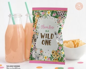 May include: Pink and green party favor bag with a jungle animal theme. The bag has a white background with a pink border and gold glitter accents. The text on the bag reads "Olivia Rose is a Wild One".