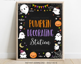 May include: A printable sign for a pumpkin decorating station. The sign is black with white, orange, green, and purple text. It features a variety of cute cartoon ghosts and pumpkins.
