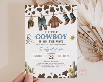 May include: A white and brown cow print baby shower invitation with a blue and white cowboy boot, blue jeans, and brown jacket hanging on a clothesline. The text reads "A Little Cowboy is on the Way!" with the date and time of the shower. The invitation also includes the name "Emily Anderson" and the address of the event.