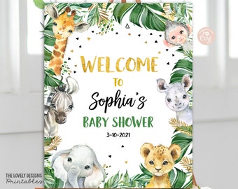 May include: Welcome to Sophia's Baby Shower sign with a jungle theme. The sign features a giraffe, zebra, rhino, monkey, lion, and elephant with green leaves and gold accents. The date is 3-10-2021.