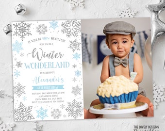 May include: A blue and silver snowflake themed invitation for a Winter Wonderland birthday party. The invitation features a photo of a baby boy wearing a grey cap and a blue bow tie. The text on the invitation reads "It will be show much fun! Join us in a Winter Wonderland to celebrate Alexander's 4th Birthday. Saturday December 15th at 5pm Alexander's House 123 SW Home Ave, LAZI 33675 RSVP to Madelyn at 3243332343"