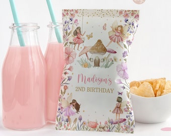 May include: A white and pink fairy-themed party favor bag with gold glitter and a floral border. The bag says "Madison's 2nd Birthday".