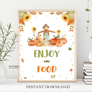 May include: Printable sign with a watercolor illustration of a scarecrow standing in a field of pumpkins and sunflowers. The sign says "Enjoy some food" with the word "food" in orange. The text "Instant Download" is at the bottom of the sign.