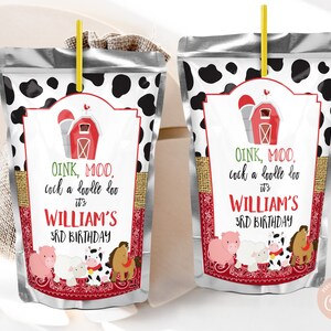 Pode incluir: Duas caixas de suco prateadas com fundos de estampa de vaca em preto e branco. Cada caixa tem um celeiro vermelho e branco com um lenço vermelho e animais de fazenda. O texto nas caixas diz "Oink, Moo, cock a doodle doo it's William's 3rd Birthday".