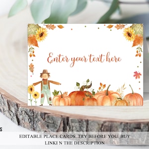 May include: Editable place card featuring a watercolor illustration of a scarecrow, sunflowers, pumpkins, and fall leaves. The text "Enter your text here" is displayed on the card.