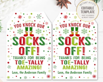 May include: Two red and green Christmas gift tags with the text "You knock our socks off! Thanks for being toe-tally amazing! Love, the Anderson Family".