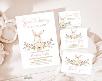May include: A pink and white baby shower invitation with a bunny rabbit illustration and the text "Some bunny is on the way!"  The invitation includes details for a baby shower honoring Meghan Taylor.  The invitation also includes a diaper raffle card, a books for baby card, and a thank you card.
