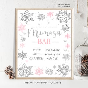 May include: Printable sign with a pink and silver snowflake design. The sign says "Mimosa Bar" and includes instructions to "Pour the bubbly, Add some juice, Garnish with fruit".