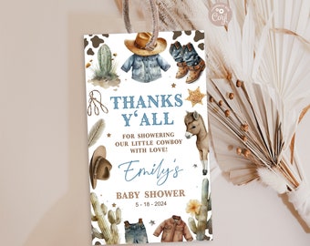 Könnte beinhalten: Eine weiße Dankeskarte mit Cowboy-Motiv. Die Karte zeigt einen blau-weißen Cowboyhut, ein blaues Jeanshemd, ein Paar braune Cowboystiefel, einen Kaktus, einen braunen und weißen Esel und den Text "Thanks Y'all" in Blau. Der Text "Emily's Baby Shower 5-18-2024" ist ebenfalls auf der Karte.