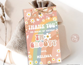 May include: A pink and orange thank you tag with a rainbow and daisies. The text reads "Thank you for making my birthday two groovy. Love, Melissa".