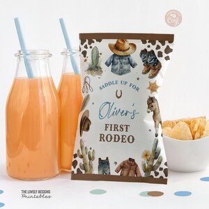May include: A brown and white party favor bag with a cowboy theme. The bag has a white background with brown spots and features a cowboy hat, boots, and a cactus. The text on the bag reads "Saddle Up For Oliver's First Rodeo".
