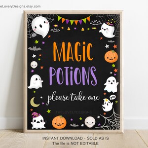 May include: A framed Halloween-themed sign with a black background. The sign features the words "MAGIC POTIONS" in orange and purple, surrounded by cartoon ghosts, pumpkins, and stars. The text "please take one" is also included.