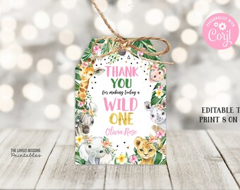 May include: Printable thank you tags with a jungle theme. The tags feature a giraffe, zebra, elephant, lion, and monkey. The text reads "Thank you for making today a wild one Olivia Rose".