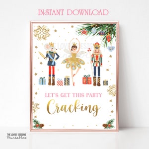 May include: A printable sign with a gold glitter background and a white border. The sign features a Nutcracker, a ballerina, and a mouse king. The text on the sign reads "Let's get this party cracking".