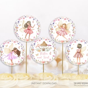 May include: Five round cupcake toppers featuring watercolour illustrations of fairies with wings and flowers. The text "Flutter and Twirl" is on one topper.