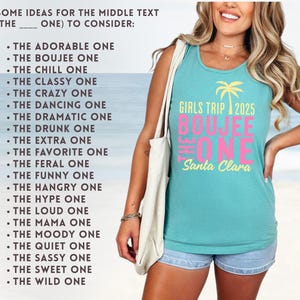 May include: A teal sleeveless tank top featuring a yellow palm tree graphic and the text GIRLS TRIP 2025 THE BOUJEE ONE Santa Clara in yellow and pink. The shirt is paired with light blue denim shorts and a white tote bag over the shoulder.