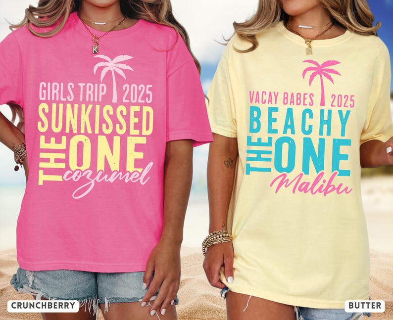 May include: A bright pink t-shirt with a palm tree graphic and text reading GIRLS TRIP 2025 SUNKISSED THE ONE Cozumel, and a pale yellow t-shirt with a palm tree graphic and text reading VACAY BABES 2025 BEACHY THE ONE Malibu.