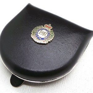 May include: A black leather coin purse with a silver trim and a gold-coloured royal crest featuring the letters "E.R." surrounded by a wreath and a crown.