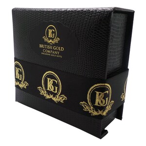 May include: Black gift box with gold lettering that reads "The British Gold Company Exclusive Gold Gifts". The box has a gold logo with the letters "KG" on the front and the sides.
