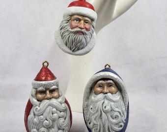 Tres hermosos adornos de cara de Santa Claus pintados de cerámica antigua