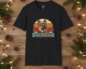 May include: Black t-shirt featuring a German Shepherd dog graphic with a sunset background. The text "German Shepherd Mama" is displayed below the dog. The design is printed on a black t-shirt.