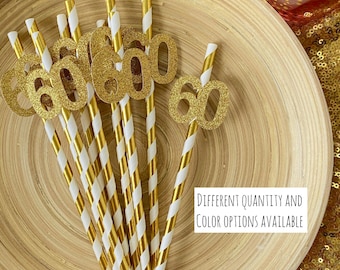 May include: Gold glitter '60' paper straws with white and gold striped paper.  The straws are on a wooden plate.  "Different quantity and color options available" is written below the straws.