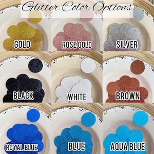 May include: A selection of glitter colors for crafting projects. The colors include gold, rose gold, silver, black, white, brown, royal blue, blue, and aqua blue.