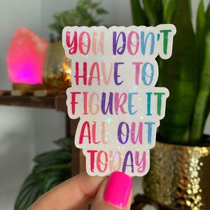 Może przedstawiać: Naklejka w tęczowych kolorach z tekstem "You don't have to figure it all out today".