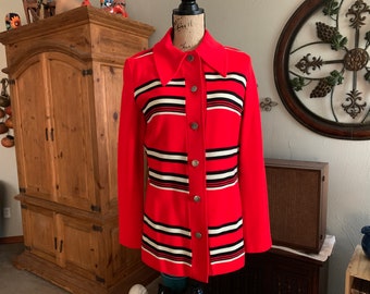 May include: A red, white, and black striped jacket with a button-up front and a collar. The jacket is on a mannequin.
