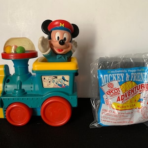 Vintage MICKEY MOUSE Collectibles – Mid Century Pull Toy And 1993 McDONALD’s Happy Meal Toy.