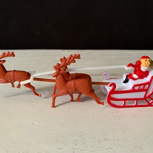 Vintage Plastic Christmas Cake Topper - Santa In His Sleigh and 3 Tiny Reindeer